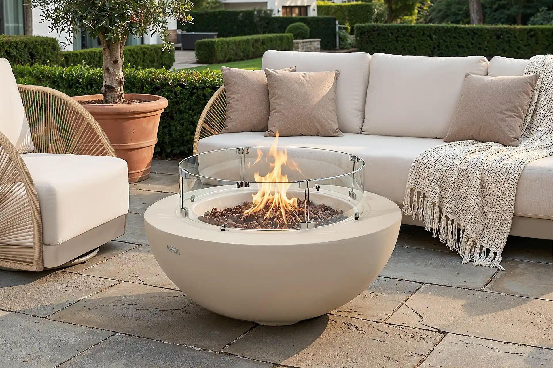 Outdoors, fire and water: a gas fire feature or water element as the centre of a garden or terrace.